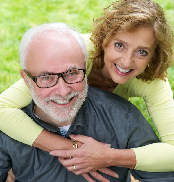 Portrait of a senior couple smiling together outdoors