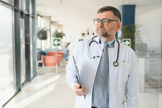 Portrait of a senior doctor in his office in a hospital