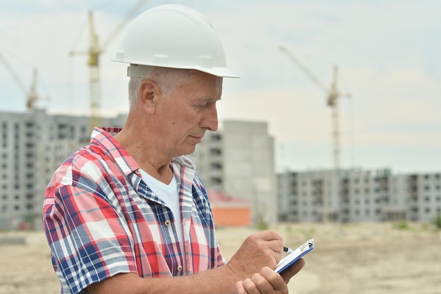 Portrait of senior man in construction site