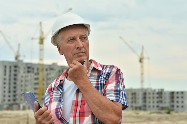 Portrait of senior man in construction site