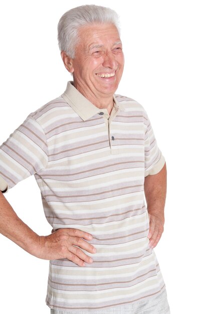 Portrait of senior man holding hands on hips on white background