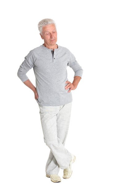 Portrait of senior man posing isolated on white background full length