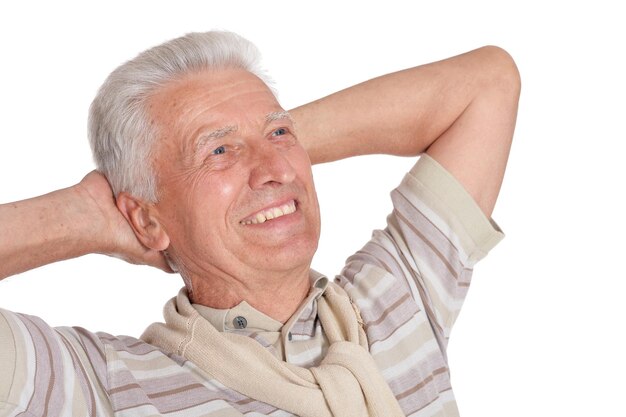 Portrait of senior man posing on white background