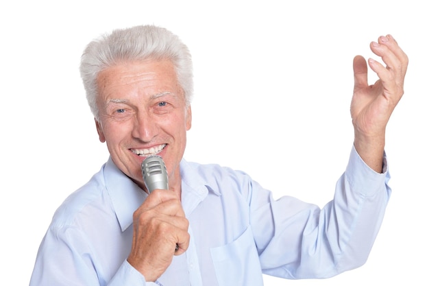 Portrait of senior man singing karaoke