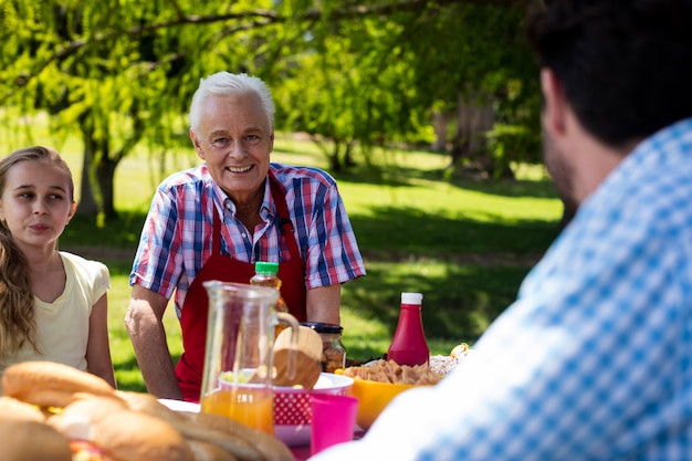 Portrait of senior man sitting in park