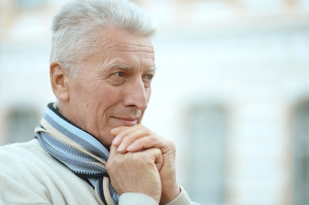 Portrait of senior man thinking about something outdoor