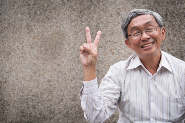 portrait senior man with glasses