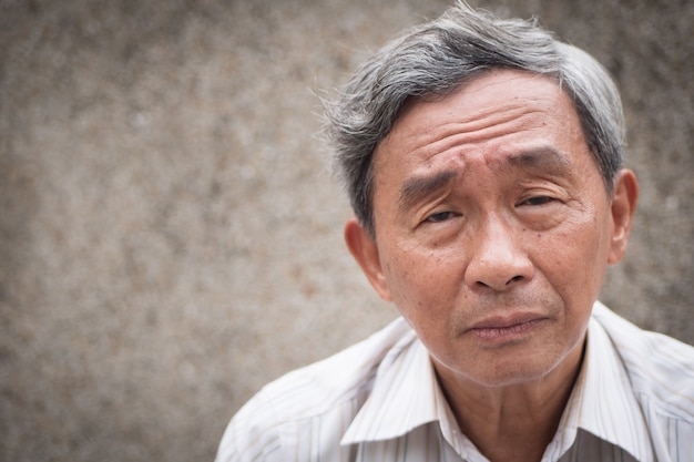 portrait senior man with glasses