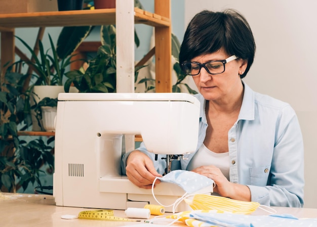 Portrait of senior man working on table