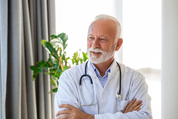 Portrait of senior mature health care professional doctor with stethoscope