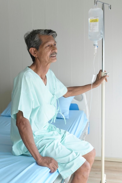 Portrait of senior patient lying on bed in hospital healthcare and medical concept