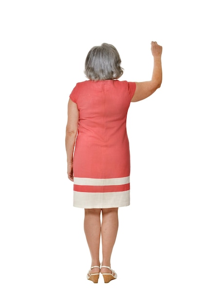 Portrait of senior woman in bright dress on white background