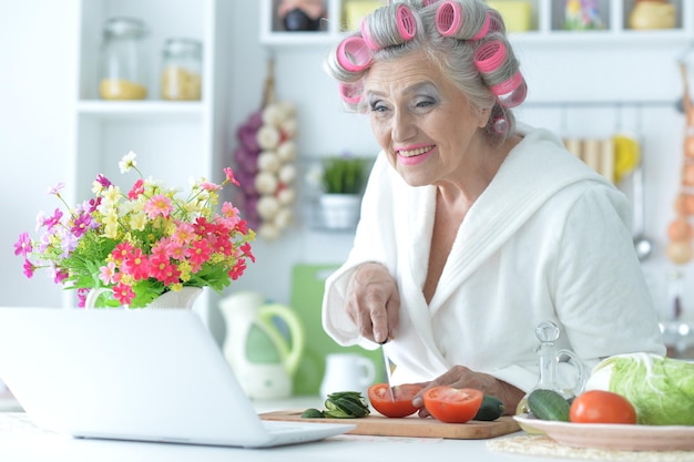 Portrait of senior woman in hair rollers