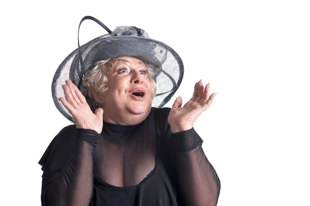 Portrait of a senior woman in hat posing