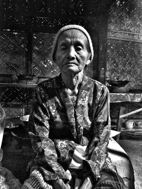 portrait of senior woman sitting outdoors