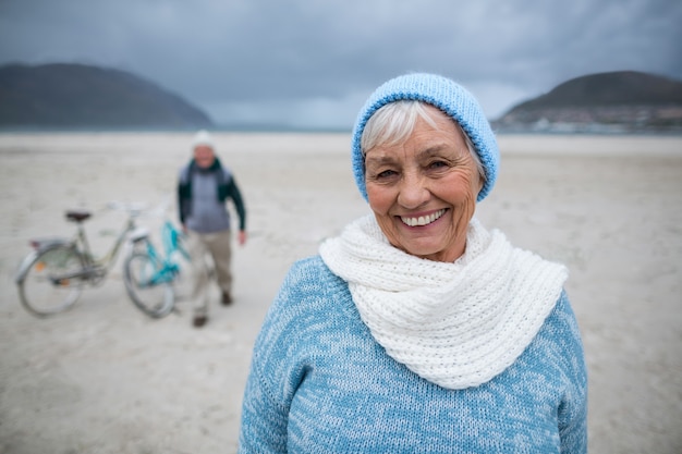 Portrait of senior woman standing on the beach