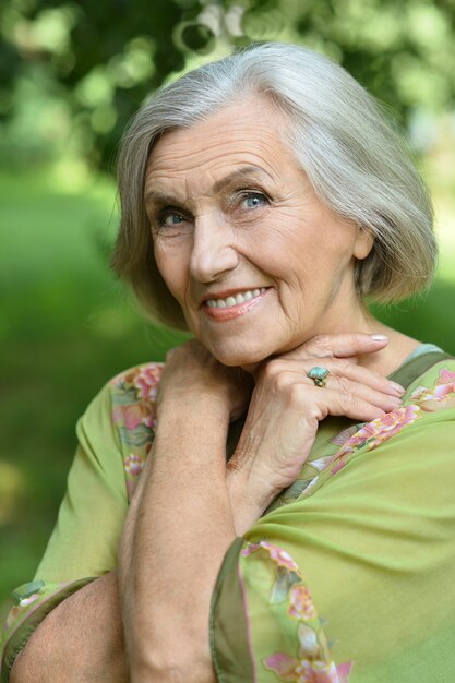 Portrait of a senior woman in summer park