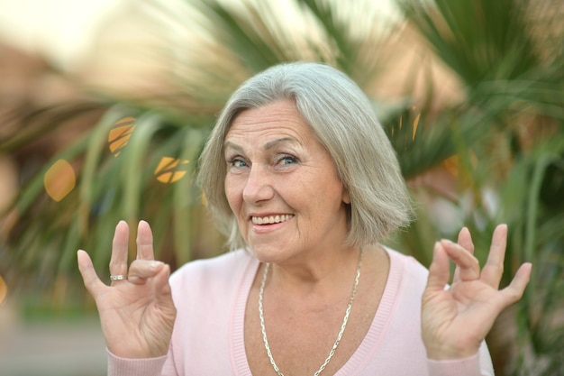 Portrait of a senior woman in summer park