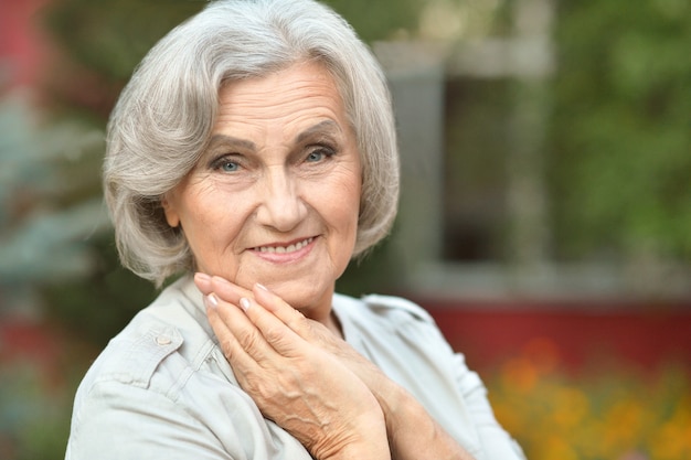 Portrait of a senior woman in summer park