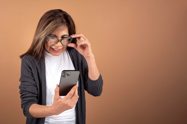 Portrait of senior woman using her smartphone