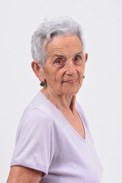 Portrait of senior woman on white background