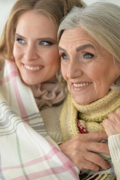 Portrait of Senior woman with daughter at home