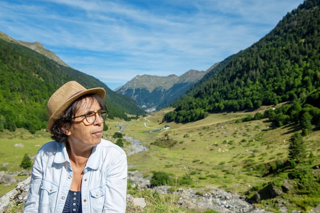 Portrait of senior woman with a summer hat