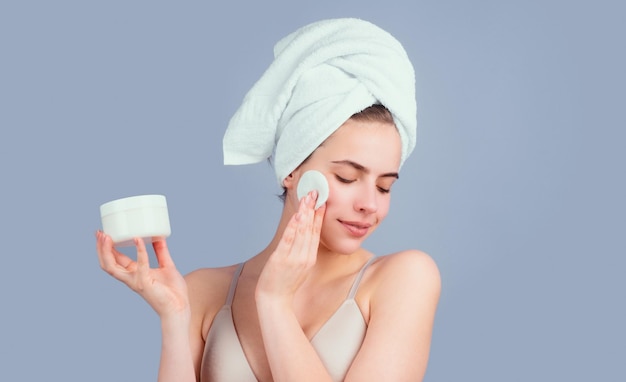 Portrait of sensual beautiful woman beauty face of a cheerful attractive girl with towel on head iso