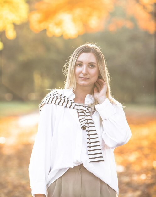 Portrait of sensual woman over autumn fall background