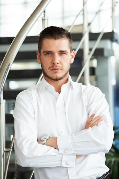 Portrait of serious businessman headshot of concentrated confident male worker or director posing in modern office