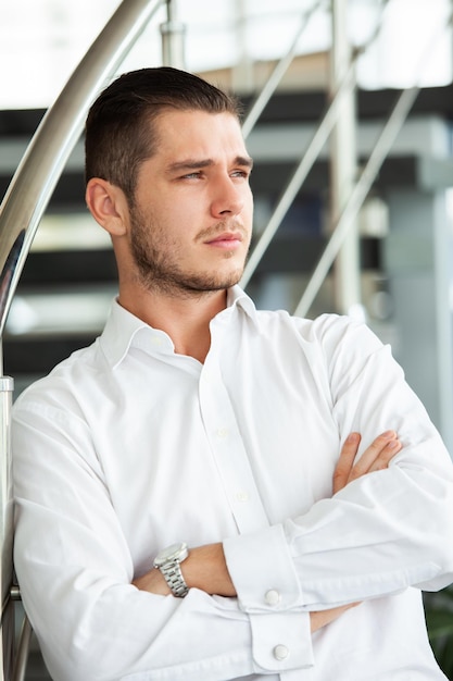 Portrait of serious businessman headshot of concentrated confident male worker or director posing in modern office