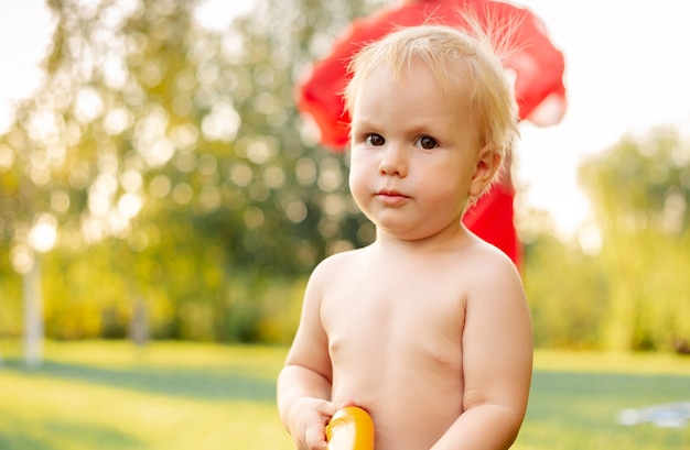 Portrait serious kid.  Beautiful caucasian child boy farmer 2 years old