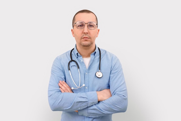 Portrait of a serious male doctor on a white background health care and medicine