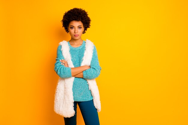 Portrait of serious pensive afro american girl feel like cool confident entrepreneur cross hands wear blue bright turquoise clothing isolated over shine color wall