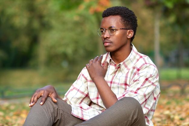 Portrait of serious pensive thoughtful unhappy sad guy young black african afro american ethnic man