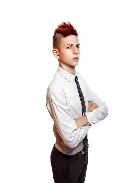 Portrait of serious teen with red mohawk wearing shirt and tie