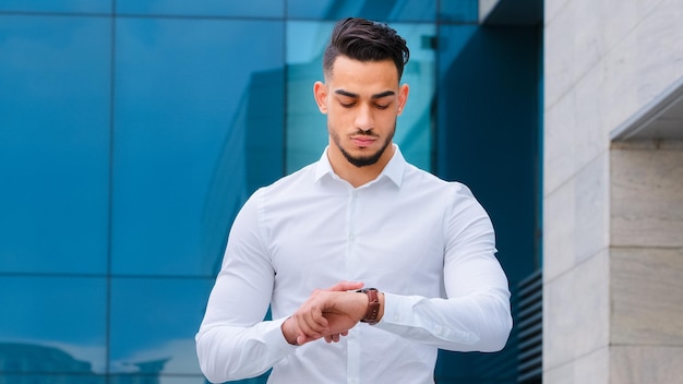 Portrait serious upset angry hispanic man bearded guy disgruntled businessman boss wears formal