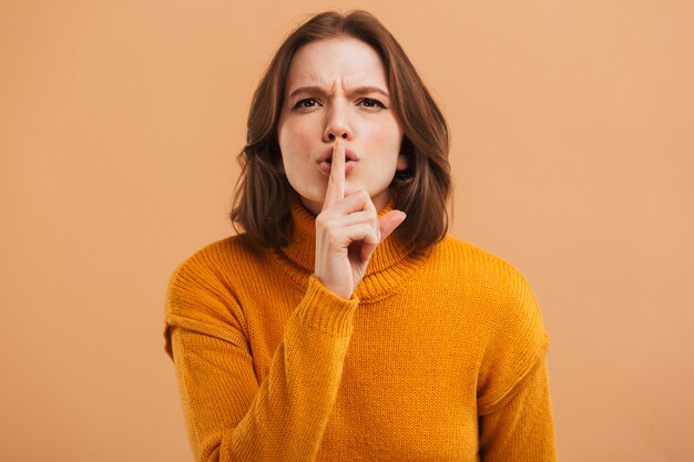 Portrait of a serious young woman in sweater