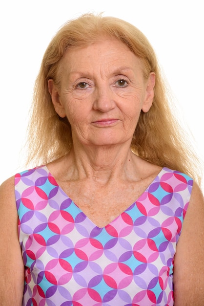 Photo portrait of a serious young woman over white background