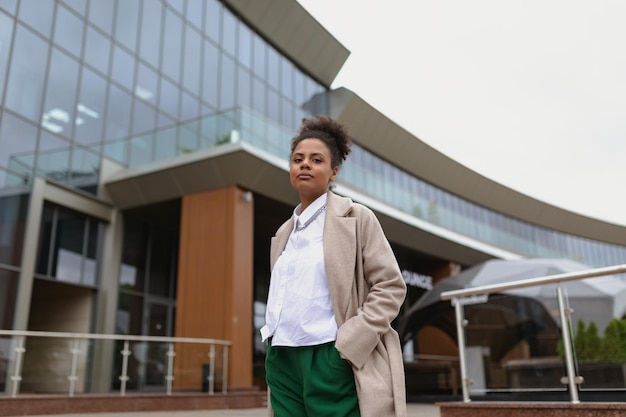 portrait of a seriously successful business african american woman in front of an office building