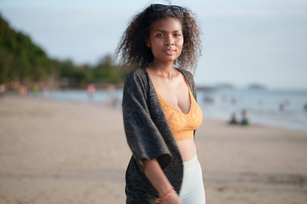 Portrait sexy Asian African lady standing and relaxing at beach The summer time at the sea and beach