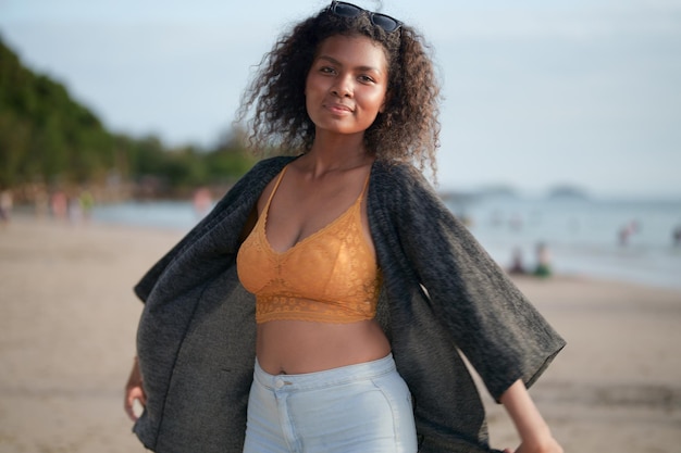 Portrait sexy Asian African lady standing and relaxing at beach The summer time at the sea and beach