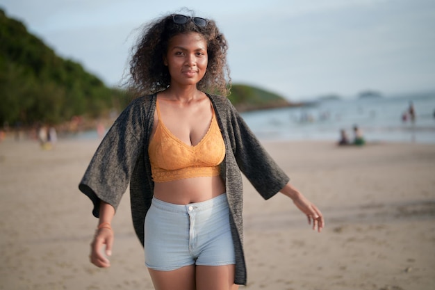 Portrait sexy Asian African lady standing and relaxing at beach The summer time at the sea and beach