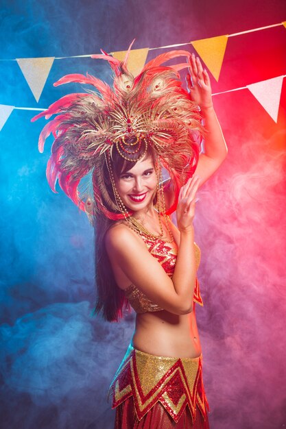 Portrait of a sexy female in a colorful sumptuous carnival costume