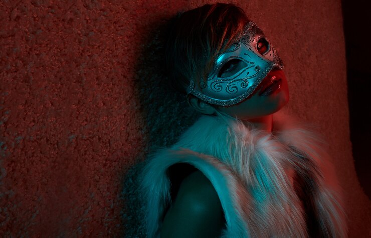 Portrait of Sexy girl in fur jacket wearing mask