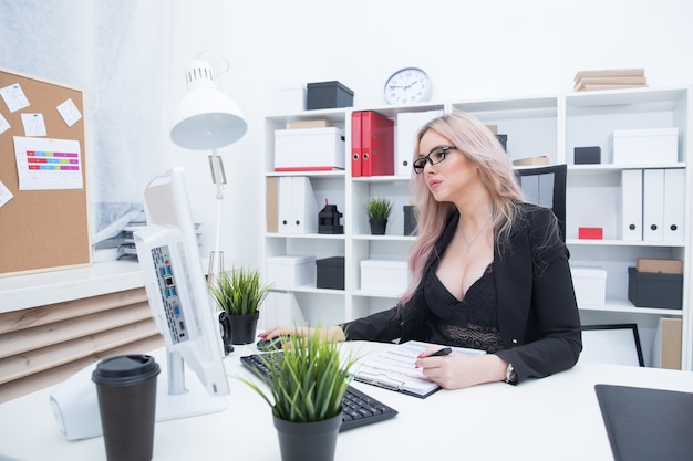 Portrait of a sexy girl in the office