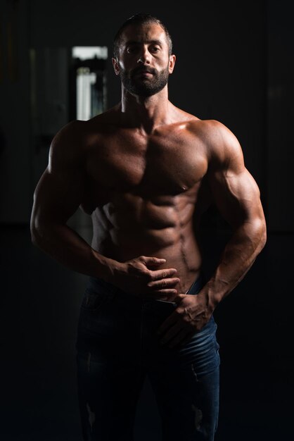 Portrait Of A Sexy Muscular Man In Pants Posing After Exercise In Gym