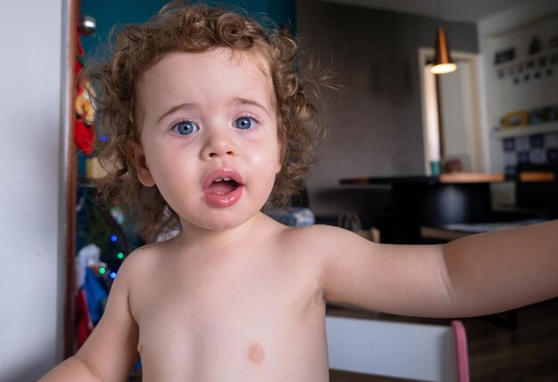 Photo portrait of shirtless baby at home