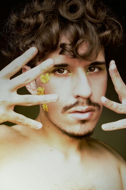 Portrait of shirtless young man gesturing