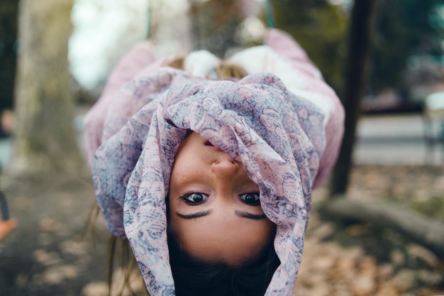 portrait of shocked girl leaning in forest